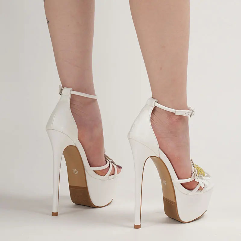 White high-heeled shoes with brown soles