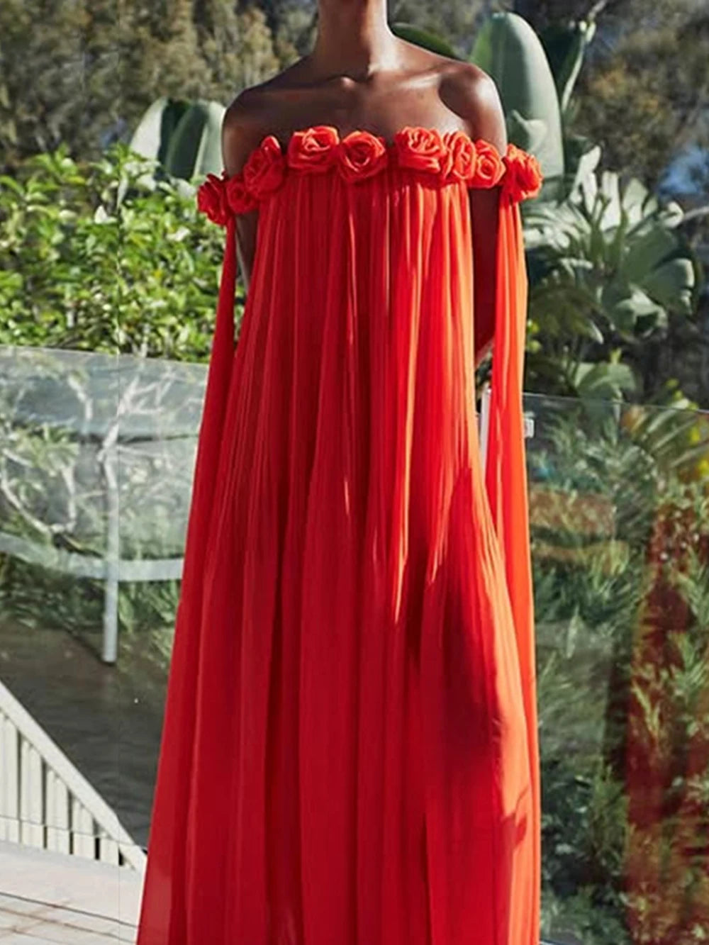 Red off-the-shoulder maxi dress with floral embellishments