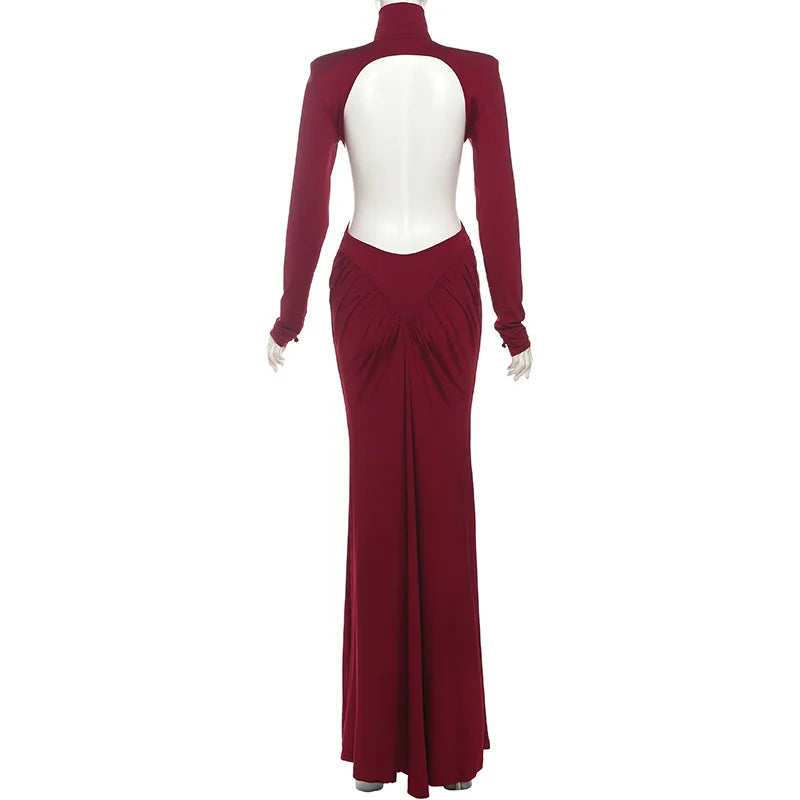 Maroon evening gown with cut-out design on a white background