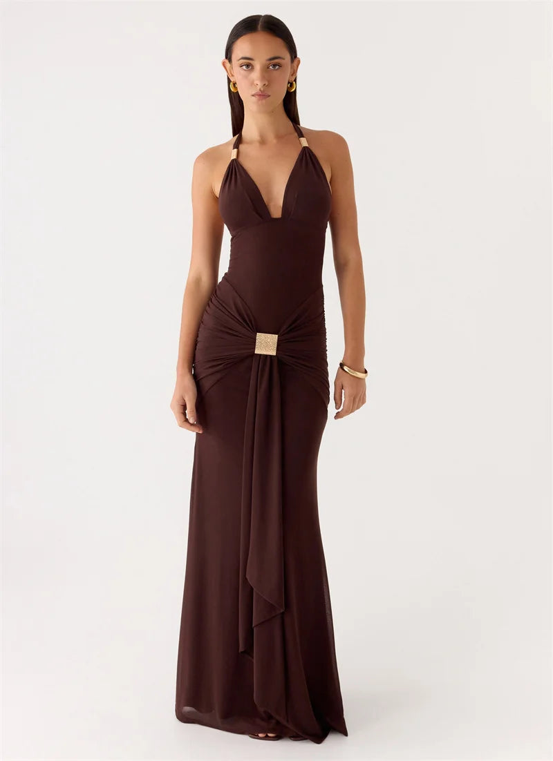 Woman wearing a brown evening gown on a white background