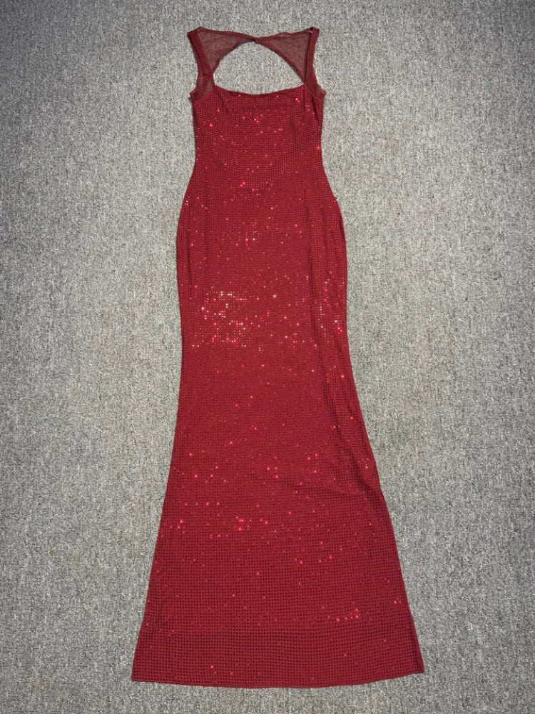 Red sequin dress on a gray surface