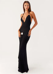 Woman wearing a black evening gown on a white background