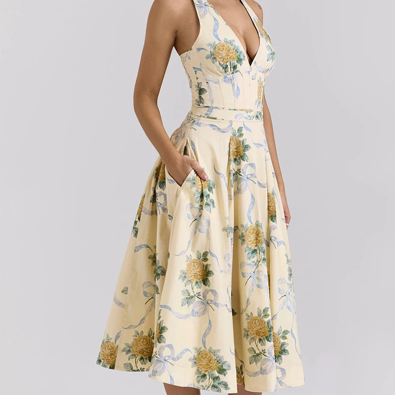 Woman in yellow floral halter midi dress with V-neck