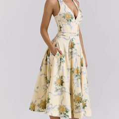 Woman in yellow floral halter midi dress with V-neck