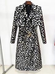 Leopard print belted trench coat hanging on a rack