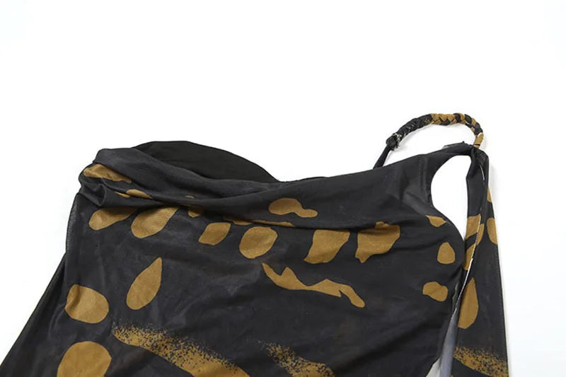 Black scarf with gold leaf patterns on a white background