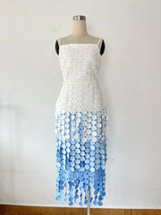 Dress with white top and blue gradient bottom on a mannequin against a white background