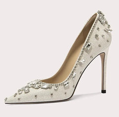 High-heeled shoe with crystal embellishments on a light background