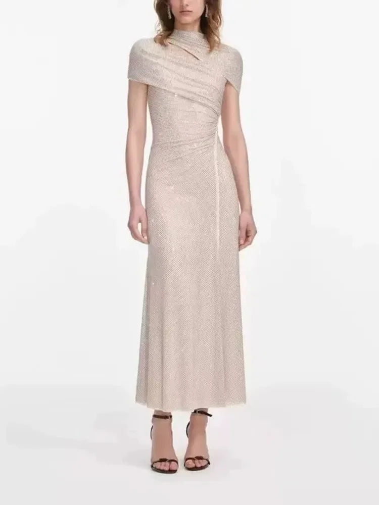 Light gold sequin midi dress with a high neckline and cut-out detail.