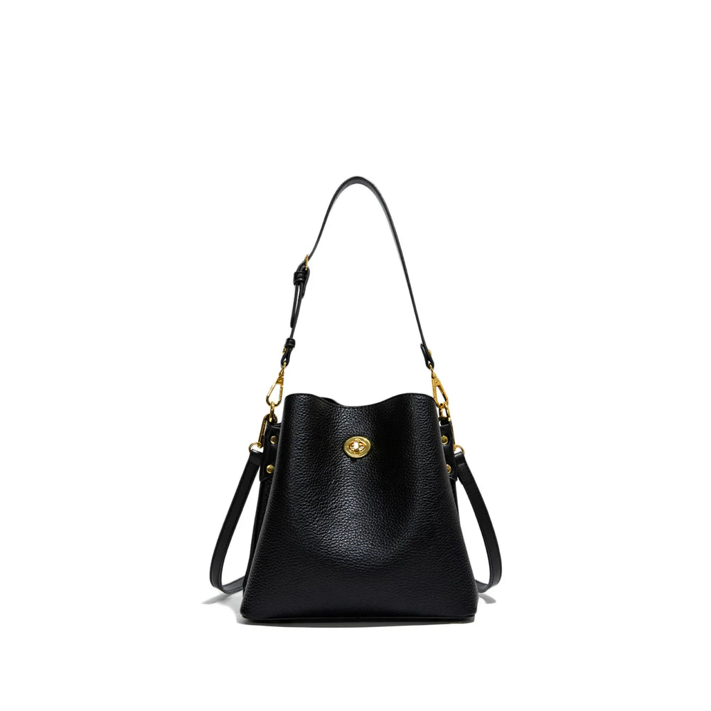 Black handbag with gold accents on a white background