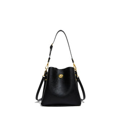Black handbag with gold accents on a white background