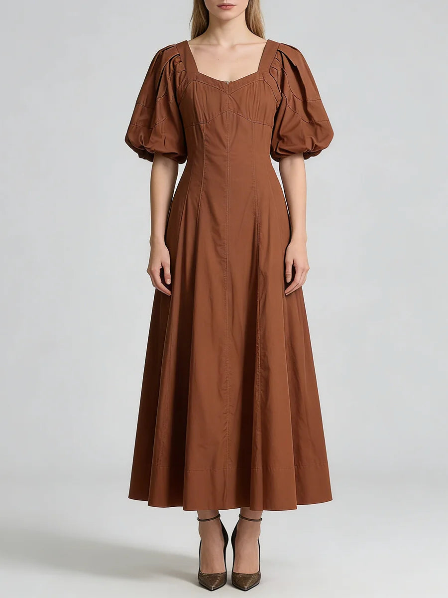 Brown dress with puff sleeves on a white background