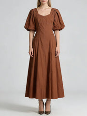 Brown dress with puff sleeves on a white background