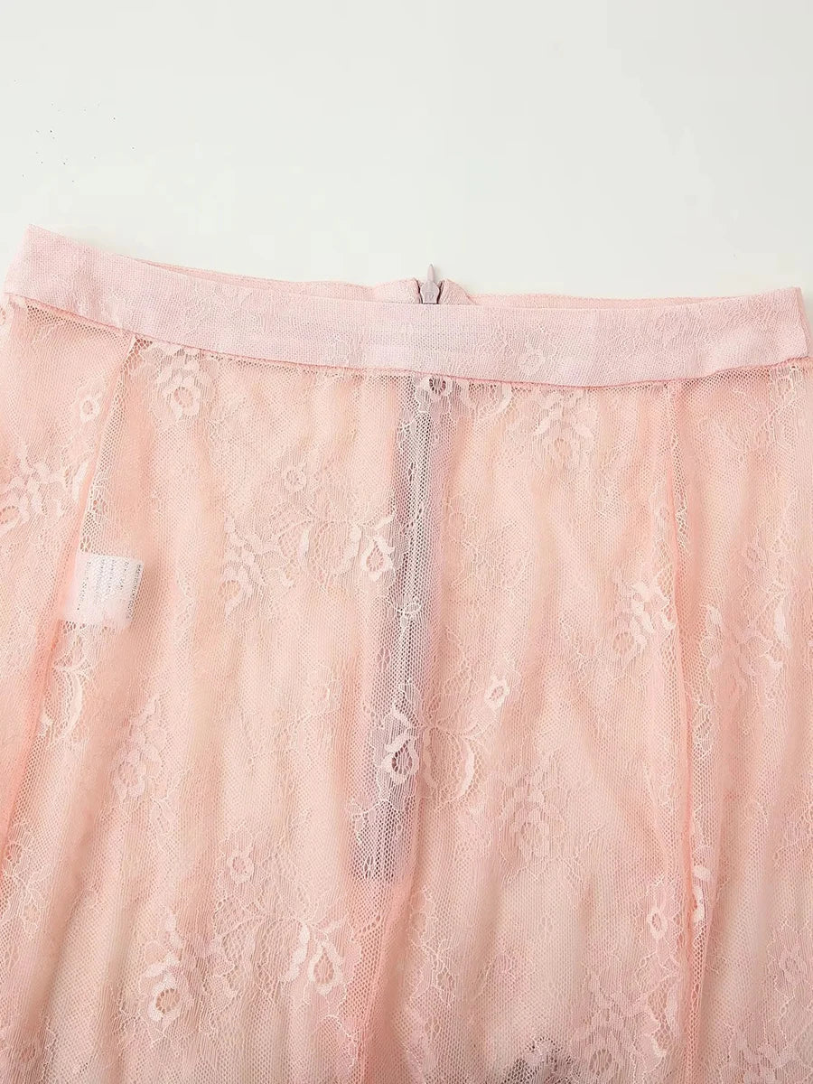 Close-up of a pink lace garment with a zipper on a white background