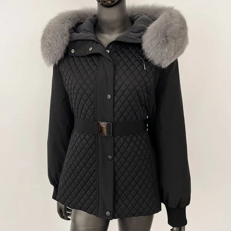 Black quilted jacket with fur-lined hood on a mannequin against a white background