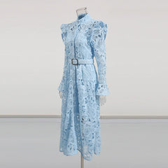 Light blue floral dress on a mannequin against a plain background