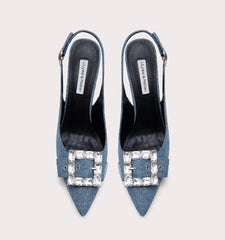 Blue high-heeled shoes with embellished buckles on a light gray background