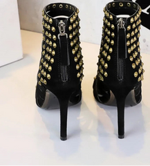Rear view of studded strappy gladiator stiletto heels