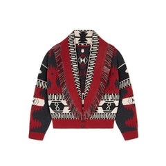 Red and black patterned cardigan with fringes on a white background