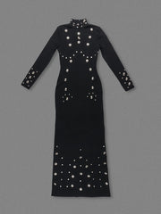 Black dress with silver embellishments on a gray background