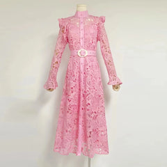 Pink lace dress on a mannequin against a white background