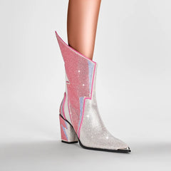Model wearing crystal embellished lightning bolt mid-calf boots with pointed toe.