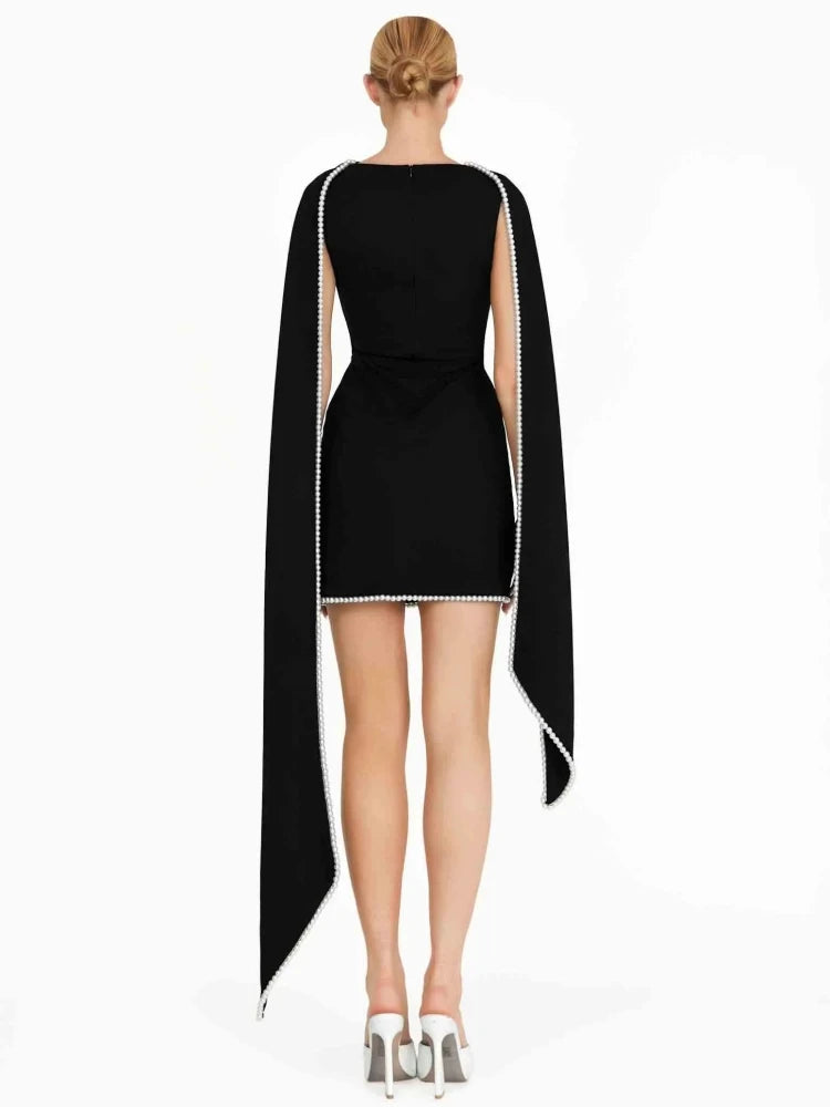 Black dress with cape on a white background