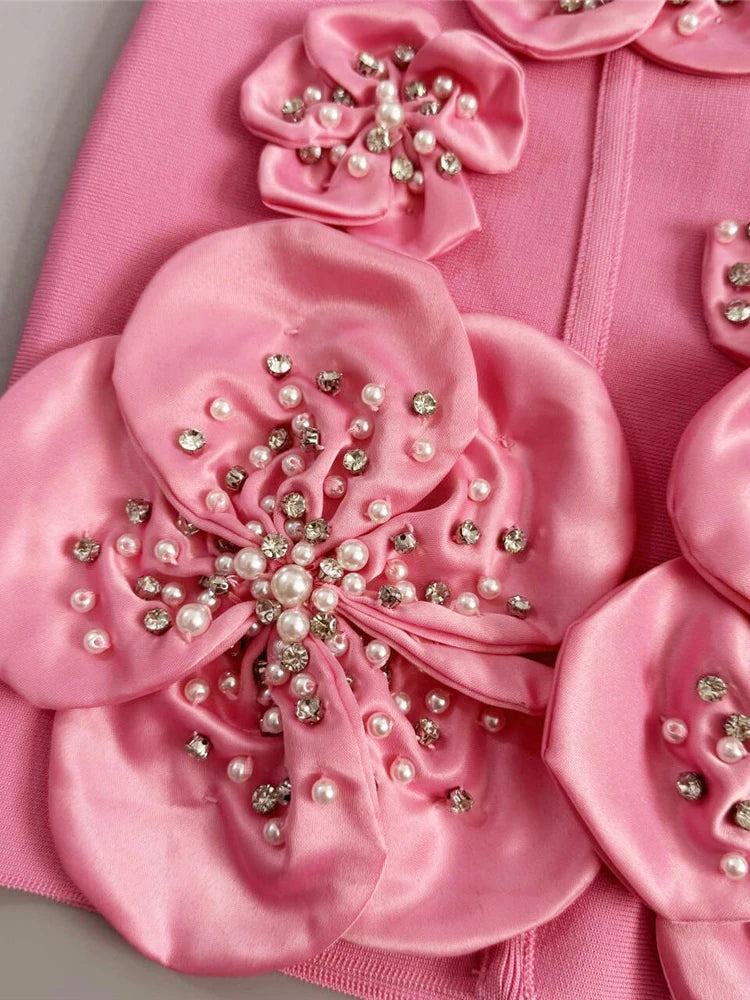 Close-up of 3D floral applique detail on mini dress