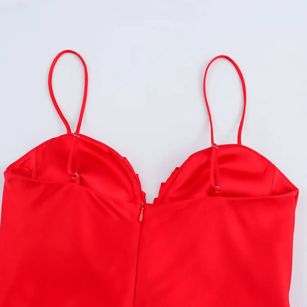 Red bikini top on a light gray background