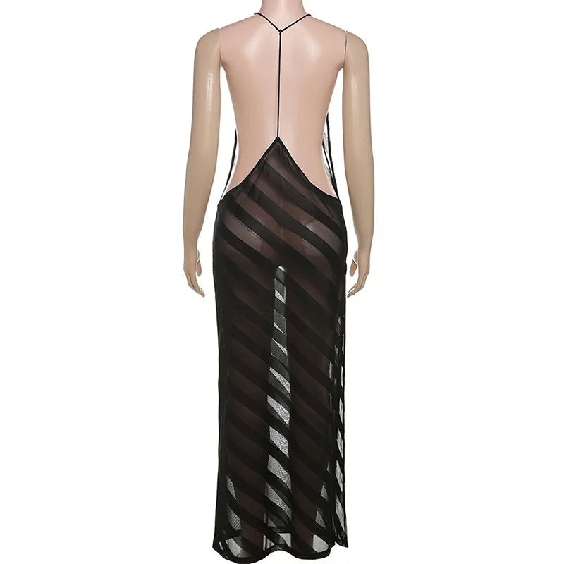 Mannequin wearing a black sheer dress with thin straps on a white background
