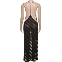 Mannequin wearing a black sheer dress with thin straps on a white background