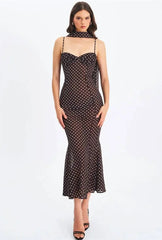 Detail of polka dot print on maxi dress