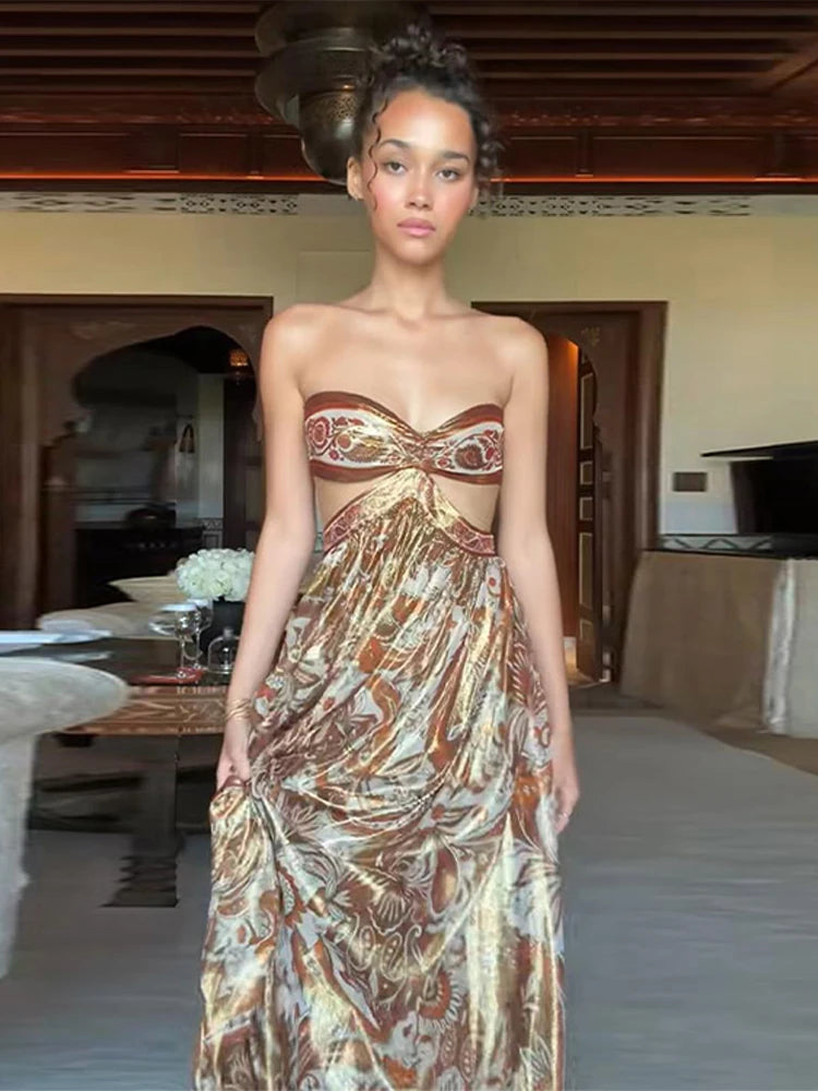Model wearing a strapless, patterned dress in an indoor setting