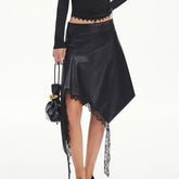 Asymmetrical faux leather midi skirt with lace trim and draped hem