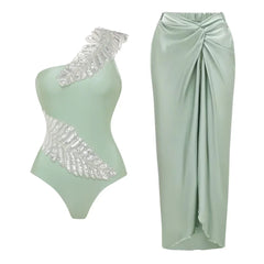 Mint green one-shoulder swimsuit with feather sequin embellishment and mint green draped maxi skirt