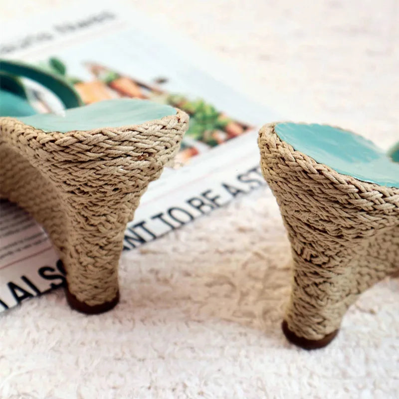 Close-up of the woven wedge heel detail on sandals