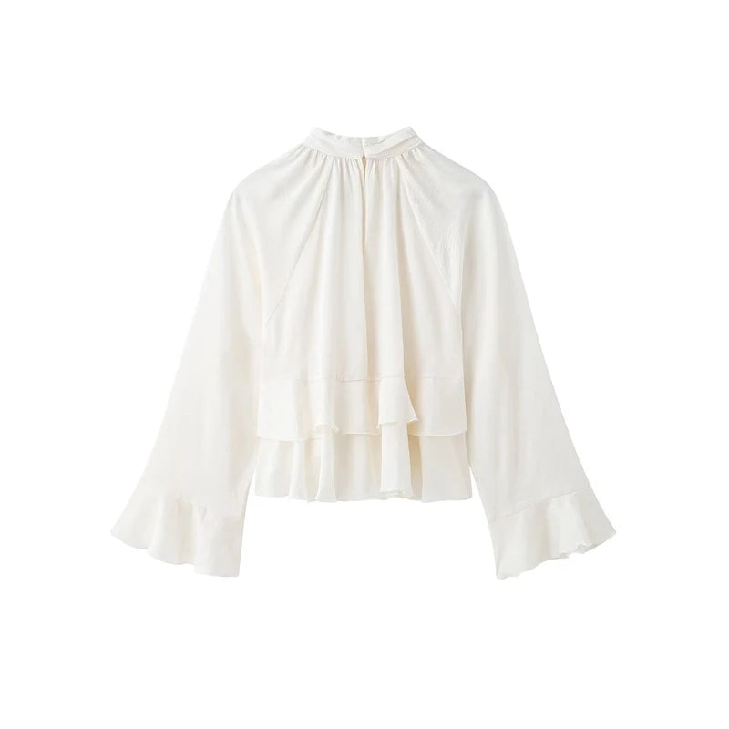 White blouse with a ruffled neckline on a white background