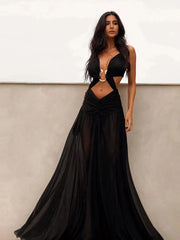 Woman wearing a black evening gown with a white background