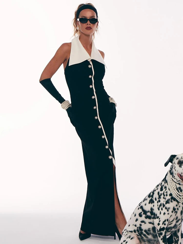 Woman in a black and white dress with a dog on a white background