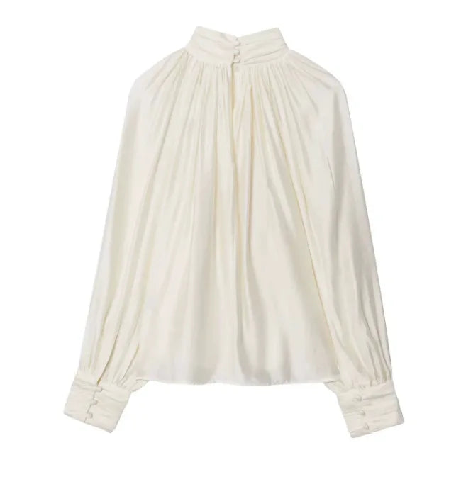 White blouse with long sleeves on a white background