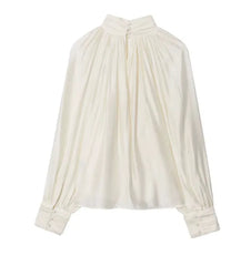 White blouse with long sleeves on a white background