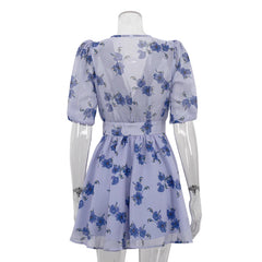 White dress with blue floral pattern on a mannequin against a white background