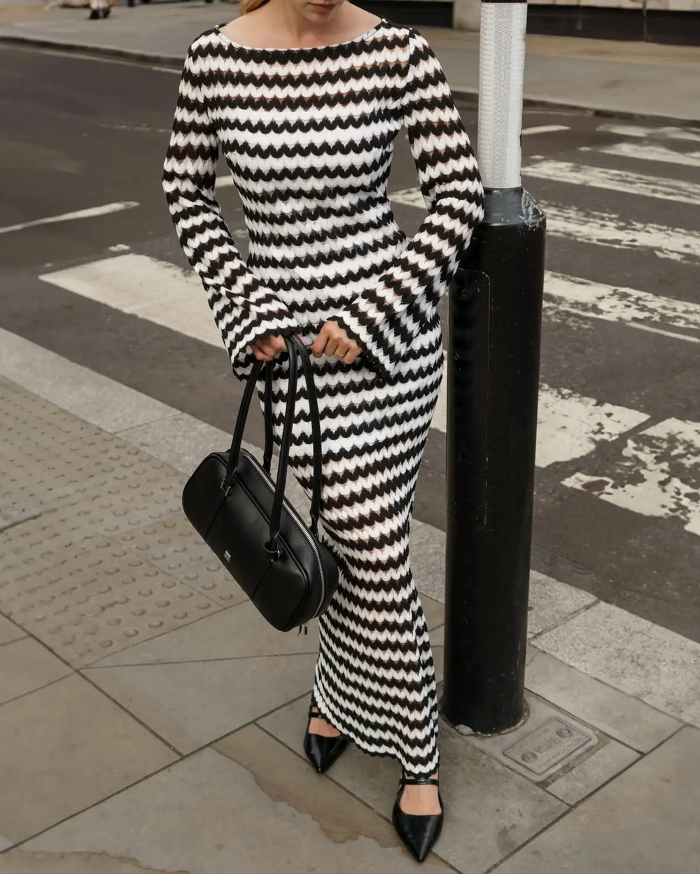 Close-up of the zigzag stripe knit pattern on a long sleeve maxi dress.