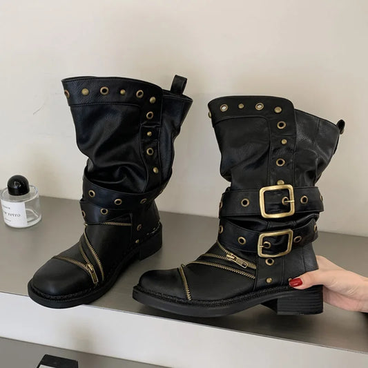 Black studded ankle boots with buckle and zipper details