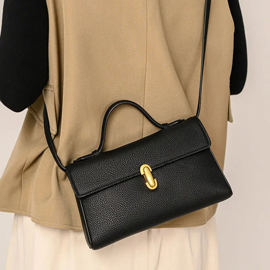Black genuine leather shoulder bag worn crossbody