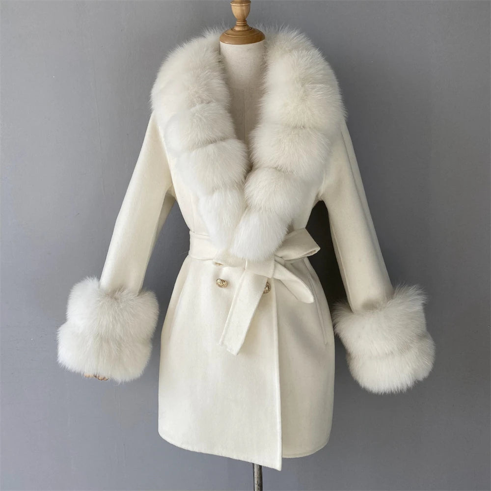 White coat with fur trim on a mannequin against a gray background