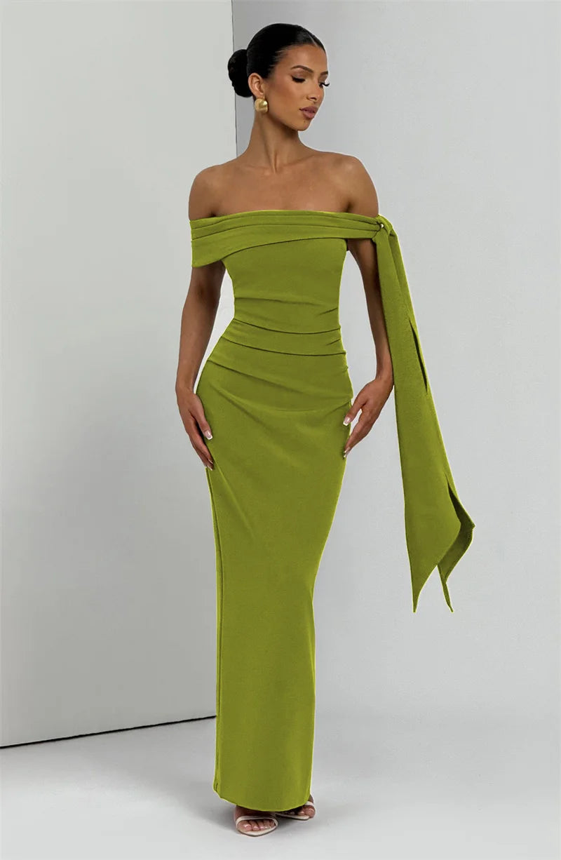 Woman wearing a green off-shoulder gown