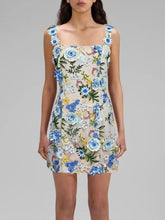 Floral dress with blue flowers on a gray background