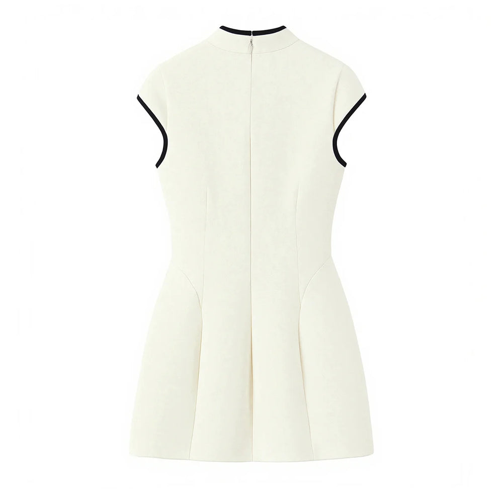 White sleeveless dress with black trim on a white background