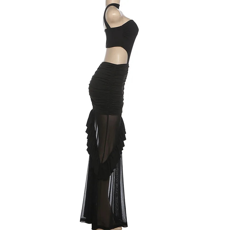 Black dress with sheer overlay on a white background